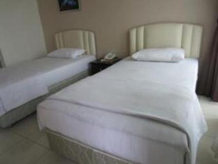 Mendu Inn Kuching Pokoj fotografie