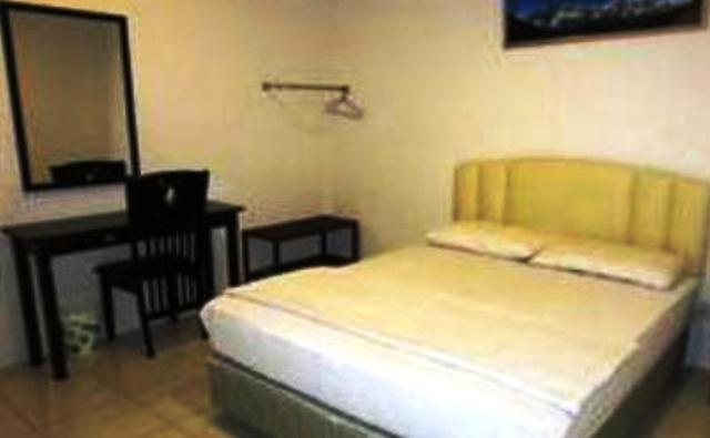 Mendu Inn Kuching Pokoj fotografie